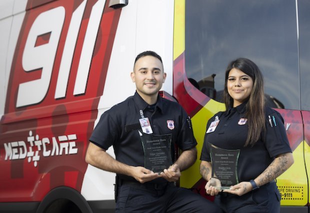Edgar Gonzalez and Brooklyn Avila holding South Texas Health System's Hometown Heroes award