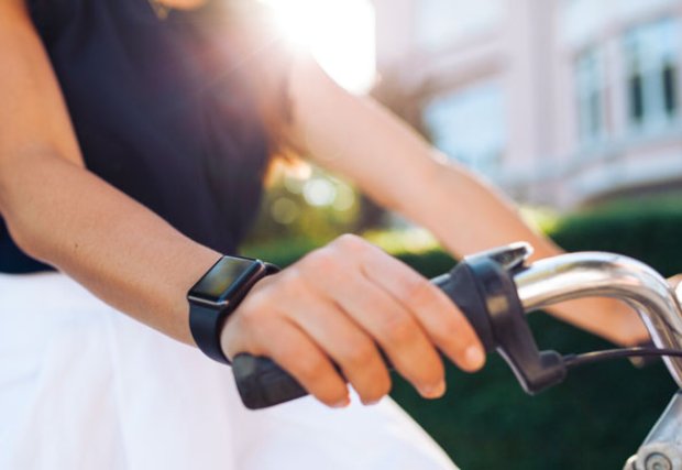 Close up of womans wrist while ridng a bike
