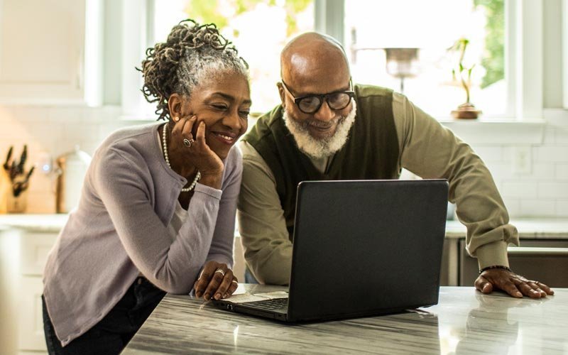 Couple taking an assessment on their laptop