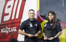 Edgar Gonzalez and Brooklyn Avila holding South Texas Health System's Hometown Heroes award