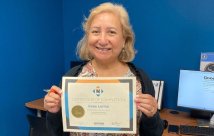 Irene Lerma holding her Goodwill certificate of completion